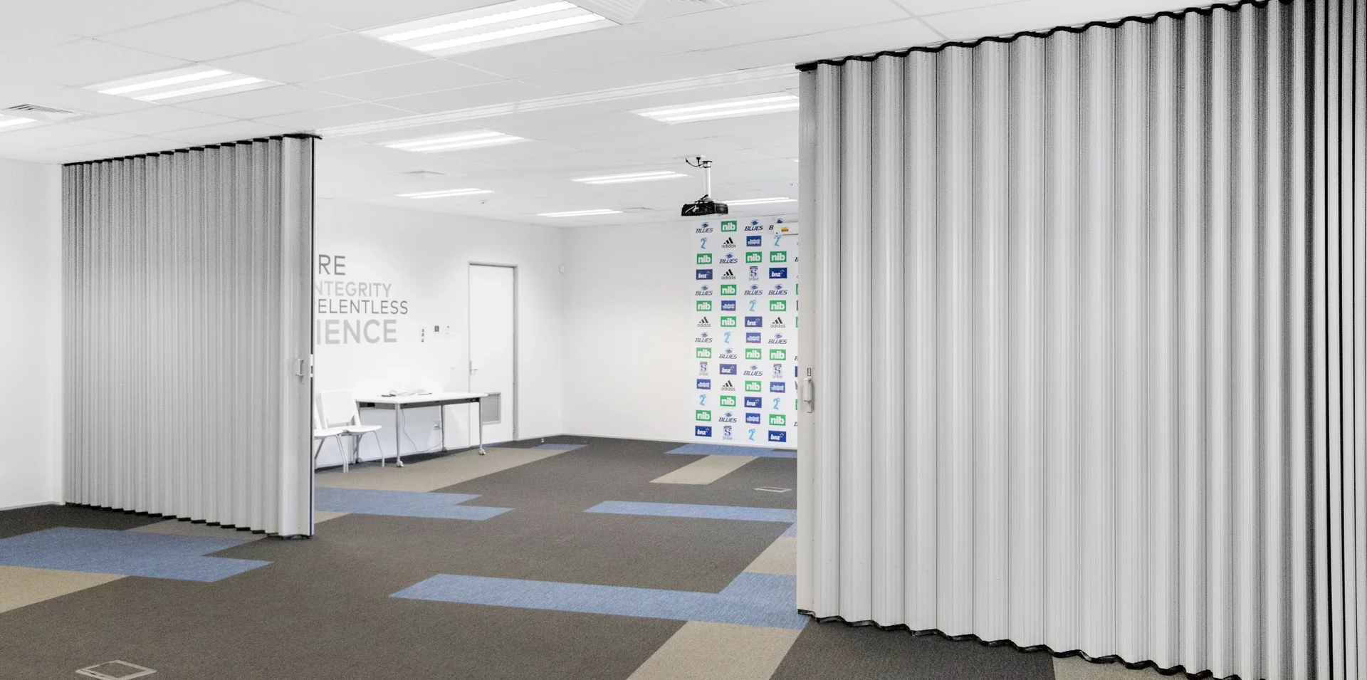 DuraSound acoustic accordion partitions dividing sports facility media room